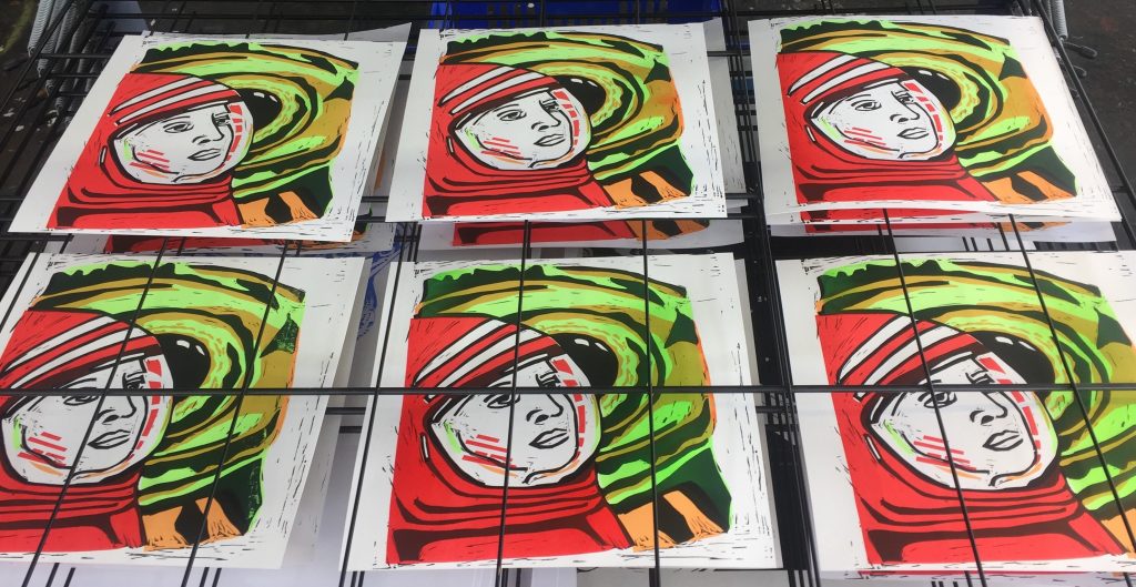 Editioned screen prints drying on the racks. These prints were made earlier in the course and are inspired by Stanley Kubrick's 2001: A Space Odyssey.